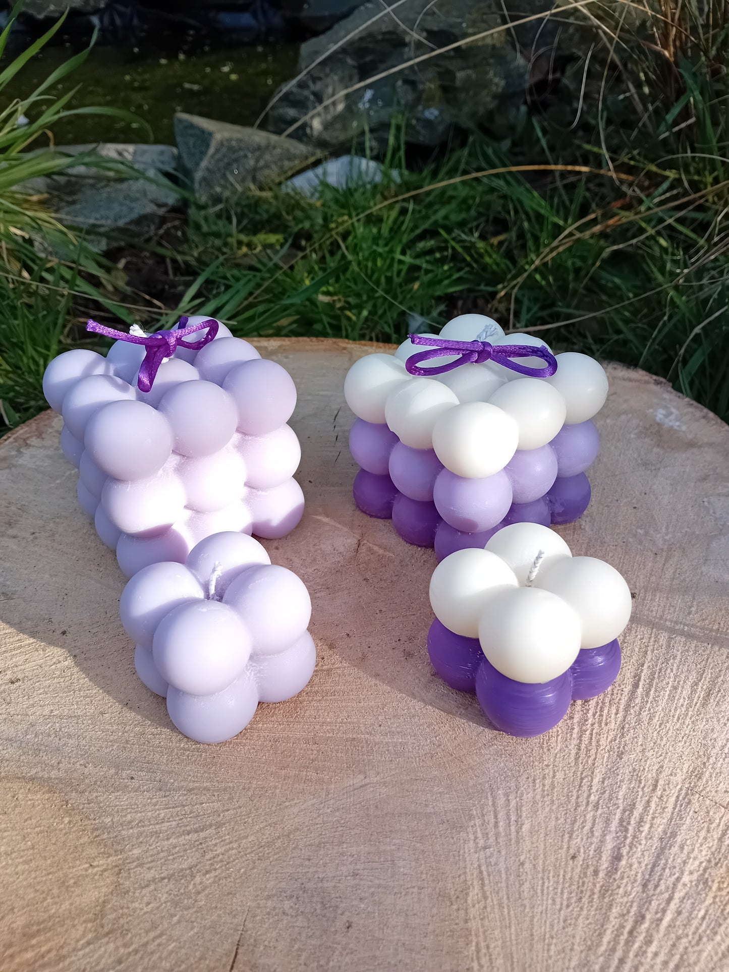 Plain lilac and ombre white/lilac fragranced Bubble candles - two of them are large, two are mini.