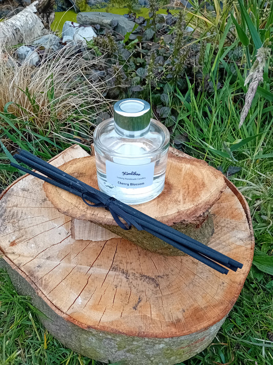 Cherry Blossom fragranced reed diffuser in a 100ml circular jar with silver cap and 7 black reeds.