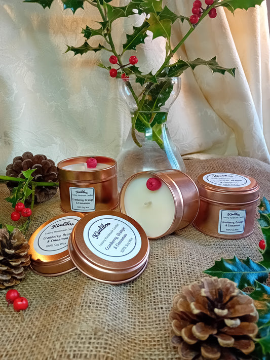 Small rose gold tin with Cranberry, Orange & Cinnamon fragranced candle and one cranberry wax decoration