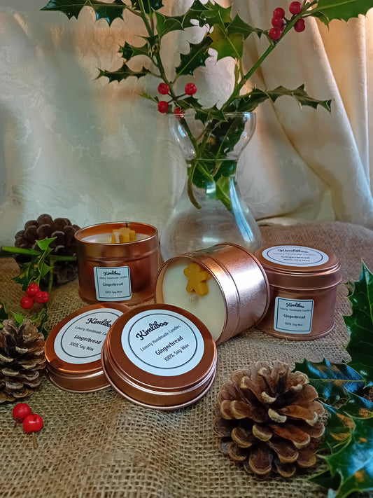 Small rose gold tin with gingerbread fragranced candle and one gingerbread man wax decoration