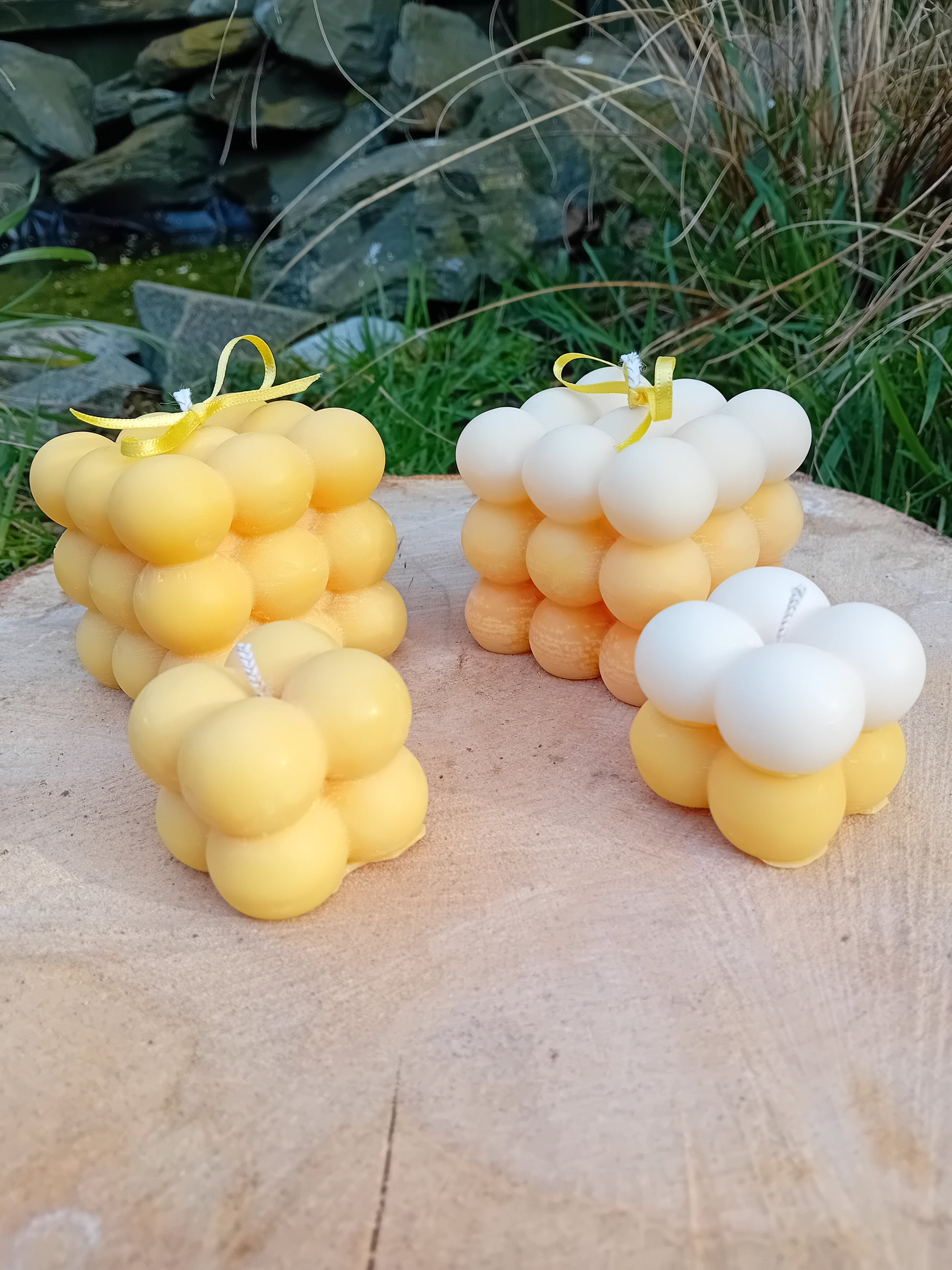 Plain yellow and ombre white/yellow fragranced Bubble candles - two of them are large, two are mini.  
